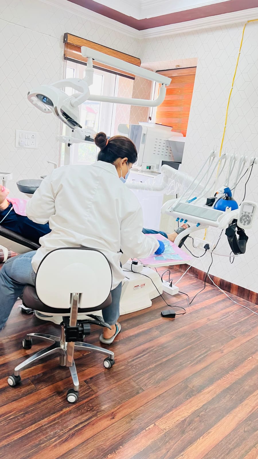 Dr. Surabhi Gupta performing advanced dental treatment at Smilesure Dental Studios